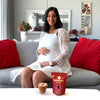 pregnant woman drinkind rooibos from red espresso brand